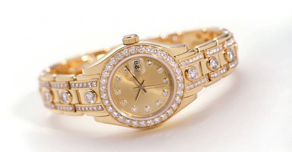 A gold watch with embedded diamonds